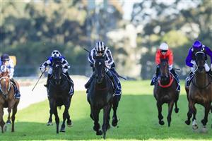 SYDNEY, AUSTRALIA - JULY 30: Jean Van Overmeire (striped cap) on Cross talk wins race 8 the Atc Foundation Winter Challenge during Sydney Racing at Rosehill Gardens on July 30, 2022 in Sydney, Australia. (Photo by Mark Evans/Getty Images)