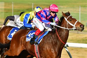 MELBOURNE, AUSTRALIA - JULY 30: Craig Williams riding Ferago winning Race 5, the Easy Foam Hand Wash Handicap, during Melbourne Racing at Moonee Valley Racecourse on July 30, 2022 in Melbourne, Australia. (Photo by Vince Caligiuri/Getty Images)