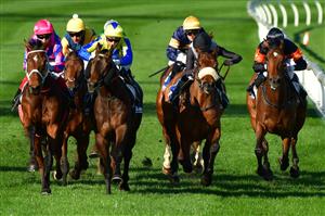 MELBOURNE, AUSTRALIA - JULY 30: Craig Williams riding Ferago (pink cap) winning Race 5, the Easy Foam Hand Wash Handicap, during Melbourne Racing at Moonee Valley Racecourse on July 30, 2022 in Melbourne, Australia. (Photo by Vince Caligiuri/Getty Images)