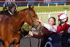 SYDNEY, AUSTRALIA - JULY 30: Hugh Bowman pats Pizarro after winning race 6 the Atc Thank You Stable Staff Handicap during Sydney Racing at Rosehill Gardens on July 30, 2022 in Sydney, Australia. (Photo by Mark Evans/Getty Images)