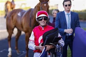 SYDNEY, AUSTRALIA - JULY 30: Hugh Bowman smiles after winning race 6 the Atc Thank You Stable Staff Handicap on Pizarro during Sydney Racing at Rosehill Gardens on July 30, 2022 in Sydney, Australia. (Photo by Mark Evans/Getty Images)