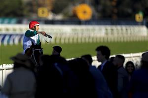 SYDNEY, AUSTRALIA - JULY 30: Hugh Bowman on Wicklow throws his goggles to the crowd after winning race 7 the Special Achievement Shelby Sixtysix during Sydney Racing at Rosehill Gardens on July 30, 2022 in Sydney, Australia. (Photo by Mark Evans/Getty Images)
