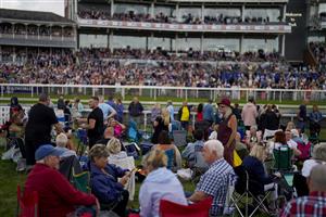 YORK, ENGLAND - AUGUST 18: Racegoers in the Clock Tower Enclosure at York Racecourse on August 18, 2022 in York, England. (Photo by Alan Crowhurst/Getty Images)