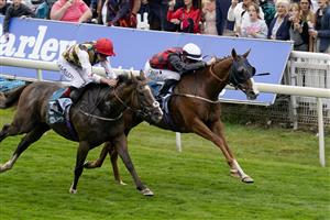 YORK, ENGLAND - AUGUST 18: Daniel Tudhope riding Blue For You (R, white cap) win The Clipper Logistics Handicap at York Racecourse on August 18, 2022 in York, England. (Photo by Alan Crowhurst/Getty Images)