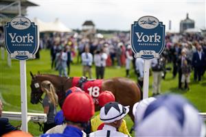 YORK, ENGLAND - AUGUST 18: Jockeys make their way to the parade ring at York Racecourse on August 18, 2022 in York, England. (Photo by Alan Crowhurst/Getty Images)