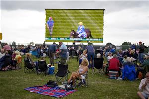 YORK, ENGLAND - AUGUST 18: Racegoers in the Clock Tower Enclosure at York Racecourse on August 18, 2022 in York, England. (Photo by Alan Crowhurst/Getty Images)