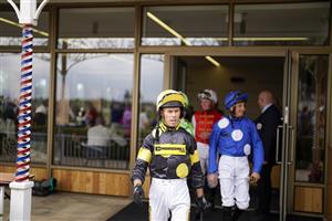 YORK, ENGLAND - AUGUST 18: Graham Lee leads the jockeys out at York Racecourse on August 18, 2022 in York, England. (Photo by Alan Crowhurst/Getty Images)