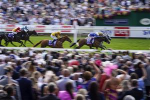 YORK, ENGLAND - AUGUST 20: Frankie Dettori riding Trawlerman (blue) win The Sky Bet Ebor Handicap from PJ McDonald riding Alfred Boucher (yellow/black) at York Racecourse on August 20, 2022 in York, England. (Photo by Alan Crowhurst/Getty Images)