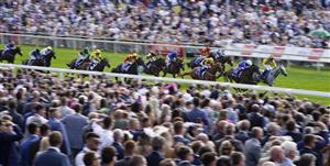 YORK, ENGLAND - AUGUST 20: Frankie Dettori riding Trawlerman (blue) win The Sky Bet Ebor Handicap from PJ McDonald riding Alfred Boucher (yellow/black) at York Racecourse on August 20, 2022 in York, England. (Photo by Alan Crowhurst/Getty Images)