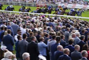 YORK, ENGLAND - AUGUST 20: Frankie Dettori riding Trawlerman (blue) win The Sky Bet Ebor Handicap from PJ McDonald riding Alfred Boucher (yellow/black) at York Racecourse on August 20, 2022 in York, England. (Photo by Alan Crowhurst/Getty Images)