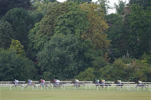 YORK, ENGLAND - AUGUST 20: Hollie Doyle riding Soulcombe (R, yellow/blue cap) sit at the rear before going on to win The Sky Bet Melrose Handicap at York Racecourse on August 20, 2022 in York, England. (Photo by Alan Crowhurst/Getty Images)