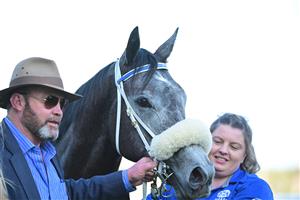 MELBOURNE, AUSTRALIA - AUGUST 27: Peter Moody poses with Chain Of Lightning after winning Race 7, the W.w. Cockram Stakes, during Melbourne Racing at Caulfield Racecourse on August 27, 2022 in Melbourne, Australia. (Photo by Vince Caligiuri/Getty Images)