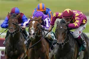 KILDARE, IRELAND - SEPTEMBER 11: Dylan Browne McMonagle riding Al Riffa (marron/yellow) win The Goffs Vincent O'Brien National Stakes at Curragh Racecourse on September 11, 2022 in Kildare, Ireland. (Photo by Alan Crowhurst/Getty Images)