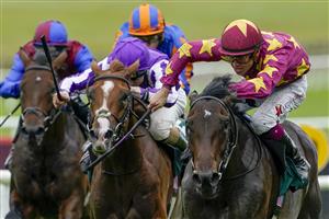 KILDARE, IRELAND - SEPTEMBER 11: Dylan Browne McMonagle riding Al Riffa (marron/yellow) win The Goffs Vincent O'Brien National Stakes at Curragh Racecourse on September 11, 2022 in Kildare, Ireland. (Photo by Alan Crowhurst/Getty Images)