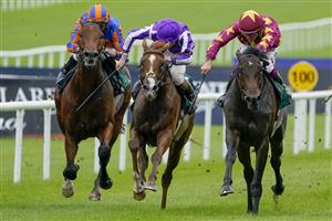 KILDARE, IRELAND - SEPTEMBER 11: Dylan Browne McMonagle riding Al Riffa (marron/yellow) win The Goffs Vincent O'Brien National Stakes at Curragh Racecourse on September 11, 2022 in Kildare, Ireland. (Photo by Alan Crowhurst/Getty Images)