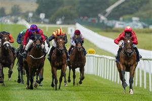 KILDARE, IRELAND - SEPTEMBER 11: Jason Hart riding Highfield Princess (R, red) win The Al Basti Equiworld, Dubai Flying Five Stakes at Curragh Racecourse on September 11, 2022 in Kildare, Ireland. (Photo by Alan Crowhurst/Getty Images)