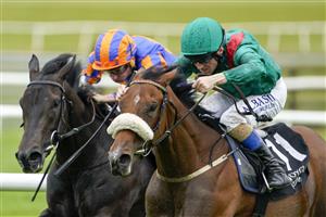 KILDARE, IRELAND - SEPTEMBER 11: Chris Hayes riding Tahiyra (green) win The Moyglare Stud Stakes at Curragh Racecourse on September 11, 2022 in Kildare, Ireland. (Photo by Alan Crowhurst/Getty Images)