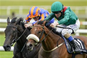 KILDARE, IRELAND - SEPTEMBER 11: Chris Hayes riding Tahiyra (green) win The Moyglare Stud Stakes at Curragh Racecourse on September 11, 2022 in Kildare, Ireland. (Photo by Alan Crowhurst/Getty Images)