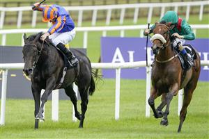 KILDARE, IRELAND - SEPTEMBER 11: Chris Hayes riding Tahiyra (green) win The Moyglare Stud Stakes at Curragh Racecourse on September 11, 2022 in Kildare, Ireland. (Photo by Alan Crowhurst/Getty Images)