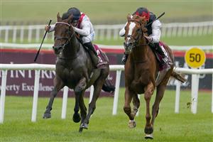 KILDARE, IRELAND - SEPTEMBER 11: Ryan Moore riding Kyprios (R) win The Comer Group International Irish St. Leger at Curragh Racecourse on September 11, 2022 in Kildare, Ireland. (Photo by Alan Crowhurst/Getty Images)