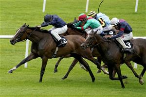KILDARE, IRELAND - SEPTEMBER 11: Ryan Moore riding Above The Curve (dark blue) win The Moyglare 'Jewels' Blandford Stakes at Curragh Racecourse on September 11, 2022 in Kildare, Ireland. (Photo by Alan Crowhurst/Getty Images)