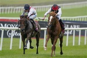 KILDARE, IRELAND - SEPTEMBER 11: Ryan Moore riding Kyprios (R) win The Comer Group International Irish St. Leger at Curragh Racecourse on September 11, 2022 in Kildare, Ireland. (Photo by Alan Crowhurst/Getty Images)