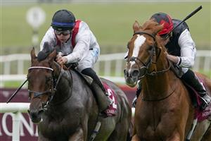 KILDARE, IRELAND - SEPTEMBER 11: Ryan Moore riding Kyprios (R) win The Comer Group International Irish St. Leger at Curragh Racecourse on September 11, 2022 in Kildare, Ireland. (Photo by Alan Crowhurst/Getty Images)