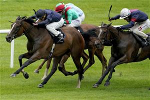 KILDARE, IRELAND - SEPTEMBER 11: Ryan Moore riding Above The Curve (dark blue) win The Moyglare 'Jewels' Blandford Stakes at Curragh Racecourse on September 11, 2022 in Kildare, Ireland. (Photo by Alan Crowhurst/Getty Images)