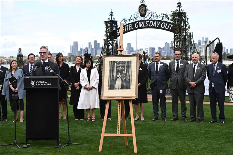 MELBOURNE, AUSTRALIA - SEPTEMBER 10: VRC Chairman, Neil Wilson, Jockeys and officials observe a minutes silence in memory of Her Majesty Queen Elizabeth II during Melbourne Racing at Flemington Racecourse on September 10, 2022 in Melbourne, Australia. (Photo by Vince Caligiuri/Getty Images)