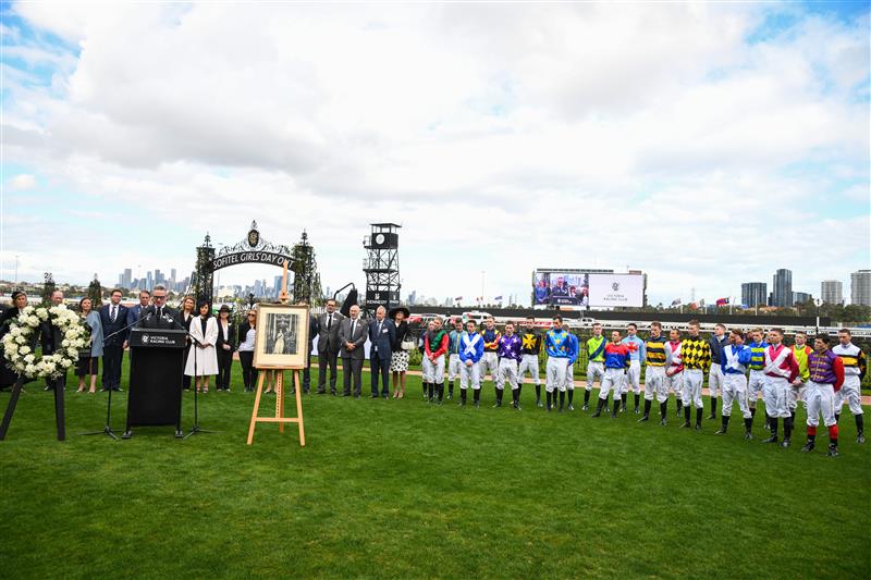 MELBOURNE, AUSTRALIA - SEPTEMBER 10: Jockeys and officials observe a minutes silence in memory of Her Majesty Queen Elizabeth II during Melbourne Racing at Flemington Racecourse on September 10, 2022 in Melbourne, Australia. (Photo by Vince Caligiuri/Getty Images)