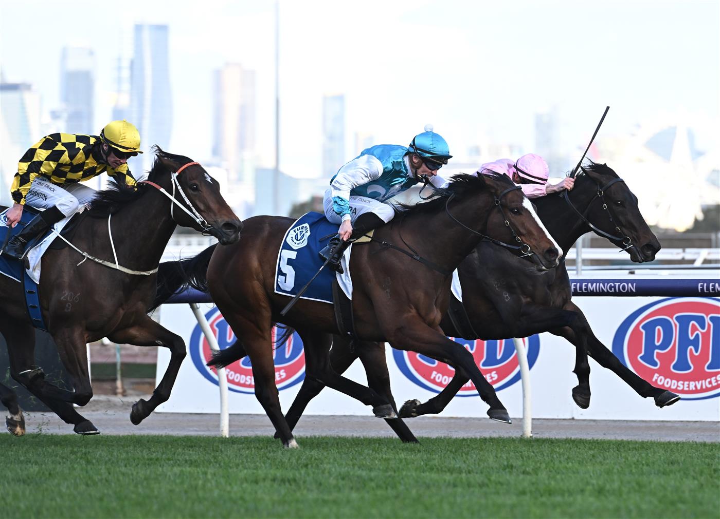 MELBOURNE, AUSTRALIA - SEPTEMBER 10: Mark Zahra riding Kissonallforcheeks winning Race 7, the Furphy Let