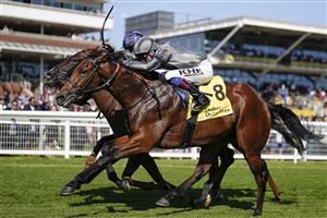 NEWBURY, ENGLAND - SEPTEMBER 17: David Egan riding Mitbaahy (grey) win The Dubai International Airport World Trophy Stakes at Newbury Racecourse on September 17, 2022 in Newbury, England. (Photo by Alan Crowhurst/Getty Images)