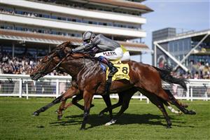 NEWBURY, ENGLAND - SEPTEMBER 17: David Egan riding Mitbaahy (grey) win The Dubai International Airport World Trophy Stakes at Newbury Racecourse on September 17, 2022 in Newbury, England. (Photo by Alan Crowhurst/Getty Images)