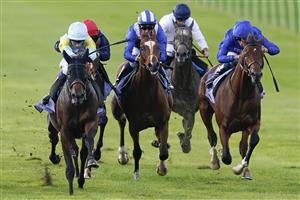 NEWMARKET, ENGLAND - SEPTEMBER 23: David Egan riding Kolsai (light blue/yellow) win The Al Basti Equiworld, Dubai British EBF 'Confined' Maiden Stakes at Newmarket Racecourse on September 23, 2022 in Newmarket, England. (Photo by Alan Crowhurst/Getty Images)
