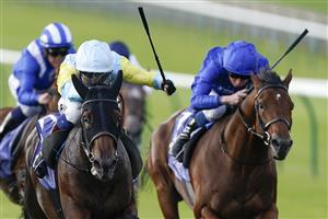 NEWMARKET, ENGLAND - SEPTEMBER 23: David Egan riding Kolsai (light blue/yellow) win The Al Basti Equiworld, Dubai British EBF 'Confined' Maiden Stakes at Newmarket Racecourse on September 23, 2022 in Newmarket, England. (Photo by Alan Crowhurst/Getty Images)