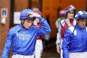 NEWMARKET, ENGLAND - SEPTEMBER 23: William Buick leads the jockeys from the weighing room at Newmarket Racecourse on September 23, 2022 in Newmarket, England. (Photo by Alan Crowhurst/Getty Images)