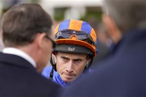 NEWMARKET, ENGLAND - SEPTEMBER 24: Ryan Moore chats with connections at Newmarket Racecourse on September 24, 2022 in Newmarket, England. (Photo by Alan Crowhurst/Getty Images)