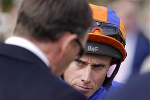 NEWMARKET, ENGLAND - SEPTEMBER 24: Ryan Moore chats with connections at Newmarket Racecourse on September 24, 2022 in Newmarket, England. (Photo by Alan Crowhurst/Getty Images)
