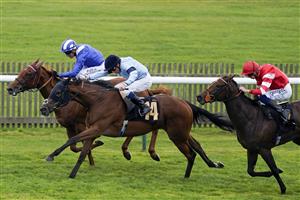 NEWMARKET, ENGLAND - SEPTEMBER 24: William Buick riding Vermilion (light blue) win The Blandford Bloodstock Maiden Fillies' Stakes at Newmarket Racecourse on September 24, 2022 in Newmarket, England. (Photo by Alan Crowhurst/Getty Images)