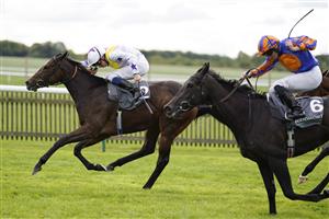 NEWMARKET, ENGLAND - SEPTEMBER 24: William Buick riding Lezoo win The Juddmonte Cheveley Park Stakes at Newmarket Racecourse on September 24, 2022 in Newmarket, England. (Photo by Alan Crowhurst/Getty Images)