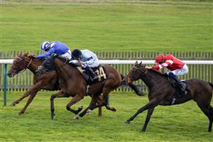 NEWMARKET, ENGLAND - SEPTEMBER 24: William Buick riding Vermilion (light blue) win The Blandford Bloodstock Maiden Fillies' Stakes at Newmarket Racecourse on September 24, 2022 in Newmarket, England. (Photo by Alan Crowhurst/Getty Images)