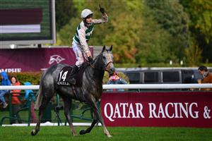 British jockey Luke Morris celebrates while riding on "Alpinista" after winning in The Prix de l