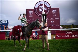 British jockey Luke Morris (L) celebrates while riding on "Alpinista" after winning in The Prix de l
