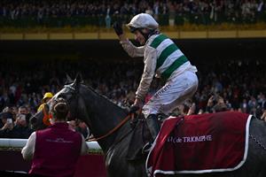 British jockey Luke Morris celebrates while riding on "Alpinista" after winning in The Prix de l