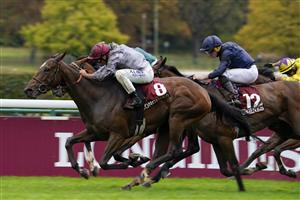 PARIS, FRANCE - OCTOBER 02: Mickael Barzalona riding Place Du Carrousel (nearest) win The Prix de l