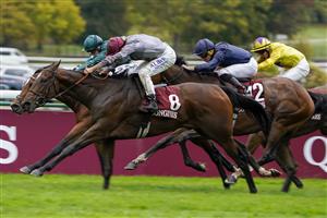 PARIS, FRANCE - OCTOBER 02: Mickael Barzalona riding Place Du Carrousel (nearest) win The Prix de l