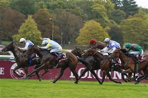 PARIS, FRANCE - OCTOBER 02: Mickael Barzalona riding Belbek (2L, light blue/yellow) win The Qatar Prix Jean-Luc Lagardere at Hippodrome de ParisLongchamp on October 02, 2022 in Paris, France. (Photo by Alan Crowhurst/Getty Images)