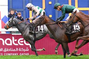 British jockey Luke Morris (L) riding on "Alpinista" crosses the finish line to win The Prix de l