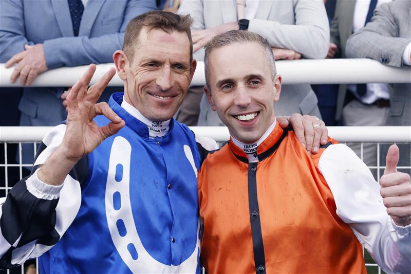 SYDNEY, AUSTRALIA - OCTOBER 01: Brenton Avdulla and Hugh Bowman pose for photos after finishing in a dead heat on Ellsberg and Top Ranked  in race 8 the TAB Epsom during Sydney Racing at Royal Randwick Racecourse on October 01, 2022 in Sydney, Australia. (Photo by Mark Evans/Getty Images)