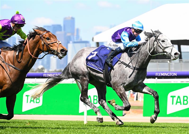 MELBOURNE, AUSTRALIA - OCTOBER 01: Jamie Kah riding Visinari winning Race 2, the Katherine Bourke Paris Lane Stakes, during Turnbull Stakes Day at Flemington Racecourse on October 01, 2022 in Melbourne, Australia. (Photo by Vince Caligiuri/Getty Images)